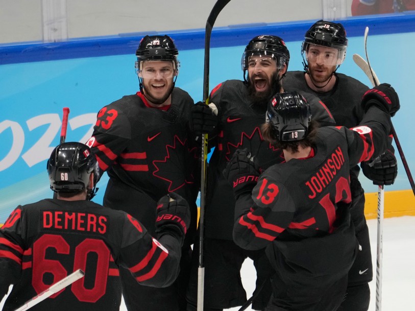 Team Canada players celebrate a goal at Beijing 2022
