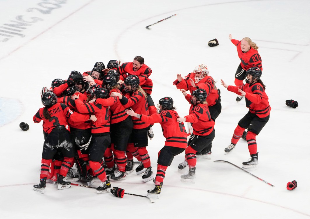 Team Canada's women's hockey team celebrates its gold medal win