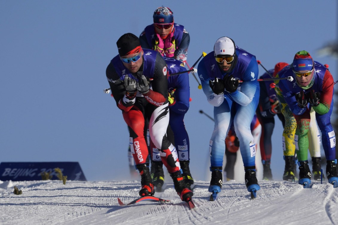 Graham Ritchie skis at the front of a pack in cross-country race