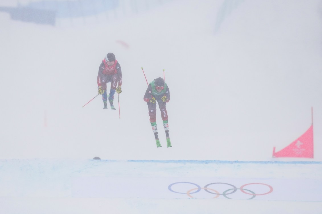 Courtney Hoffos and Hannah Schmidt cross the line in ski corss race