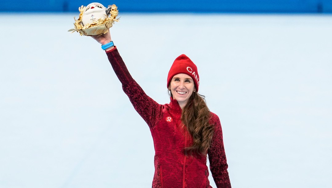 Ivanie Blondin waves her mascot on the podium