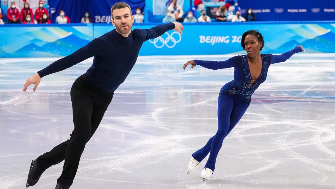 Vanessa James and Eric Radford skate side by side