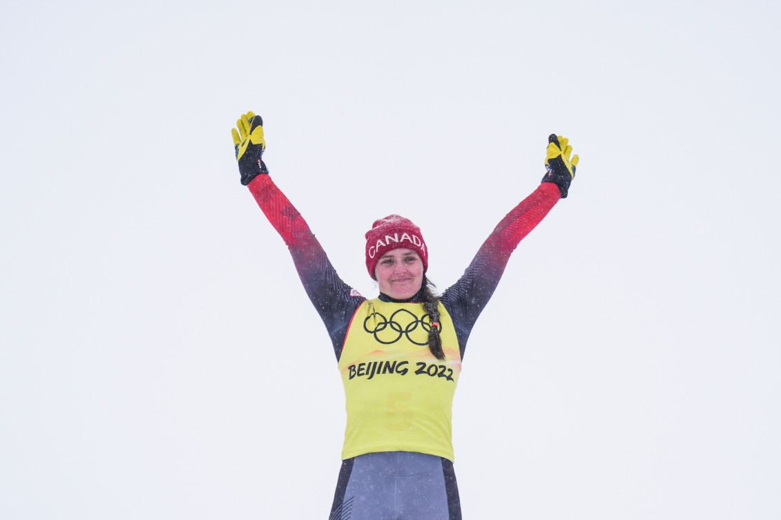 Marielle Thompson raises arms on podium