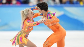 Piper Gilles and Paul Poirier dance in hold