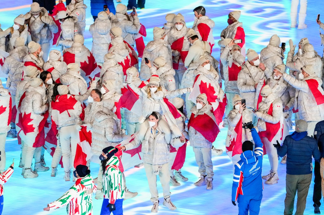 Team Canada marches into the closing ceremony