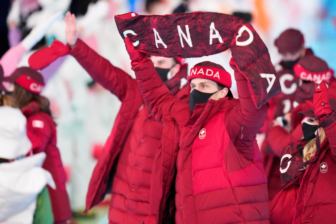 Team Canada athletes walk in the Parade of Nations