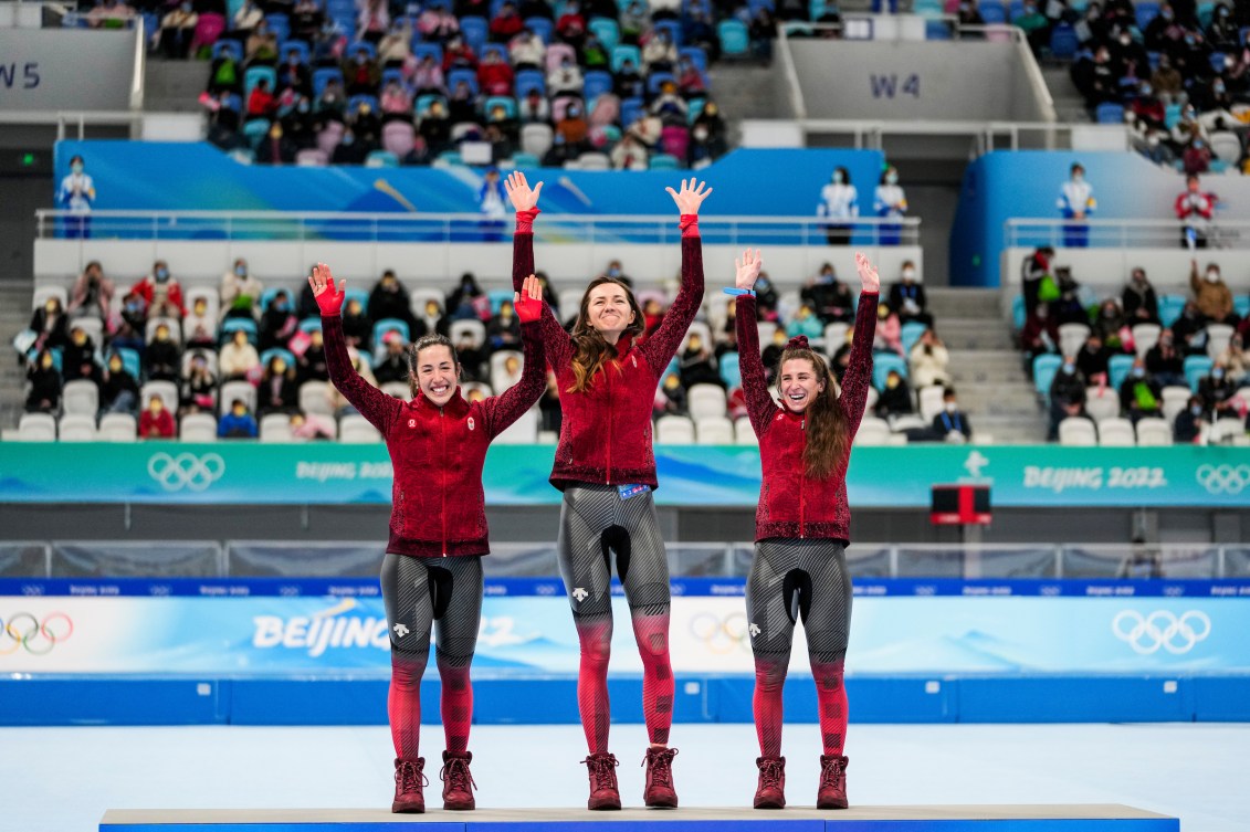 Valerie Maltais, Isabelle Weidemann and Ivanie Blondin stand on the podium