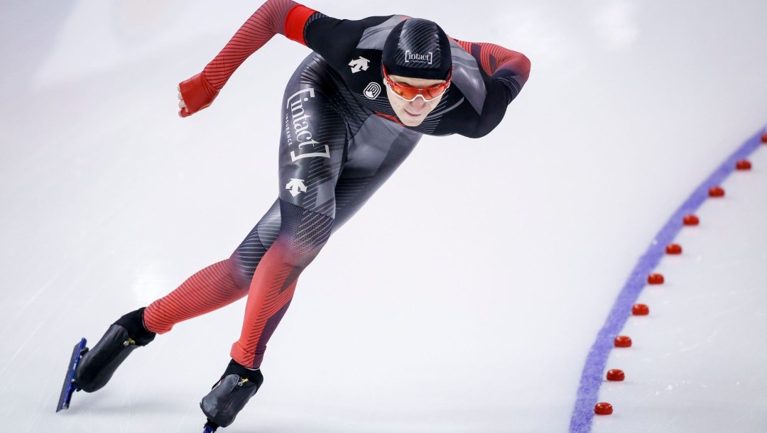 Connor Howe of Team Canada turns a corner during a speed skating event