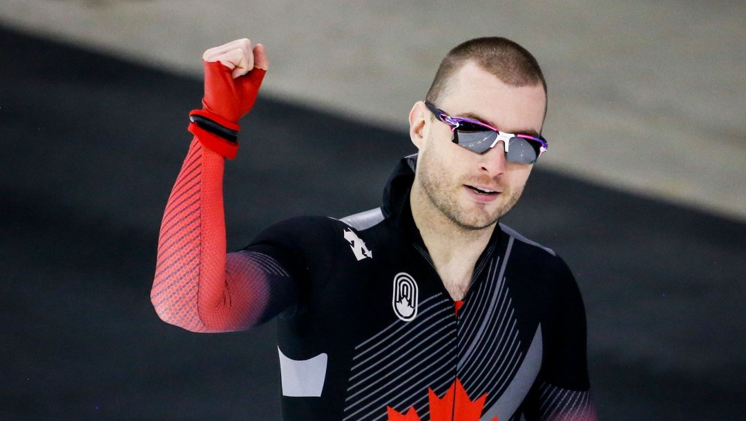 Laurent Dubreuil poses with his hand in the air after winning a World Cup event