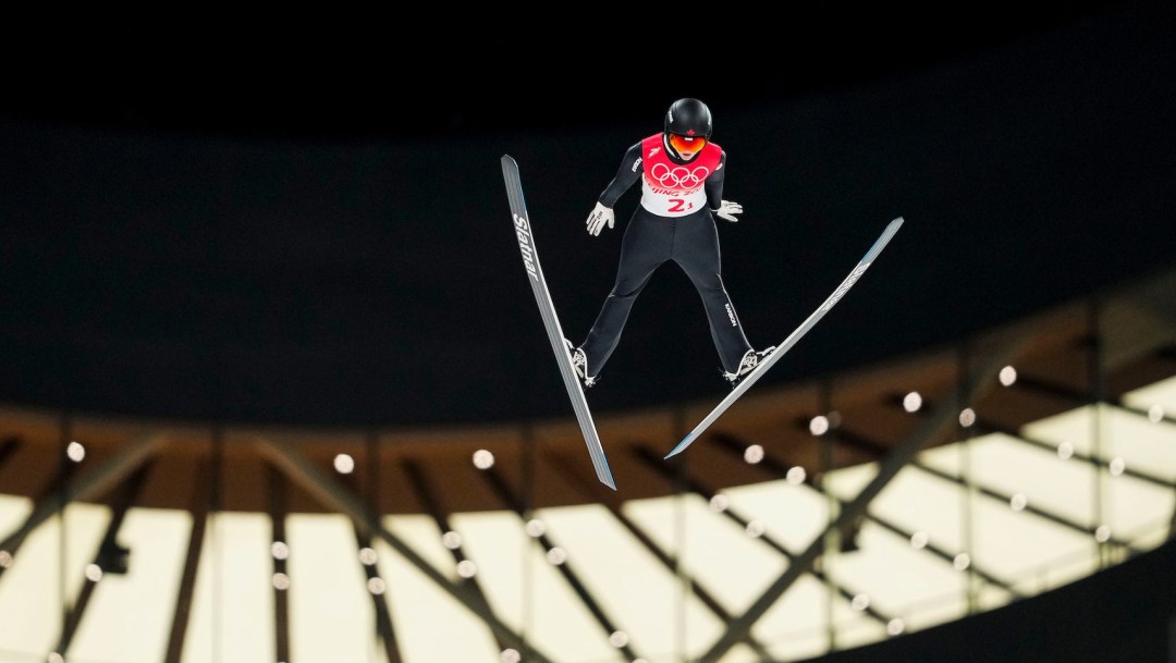 Alexandria Loutitt flies towards the camera while doing a ski jump