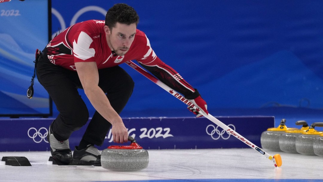 Brett Gallant prepares to push off from the hack to throw a stone