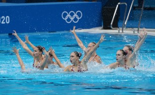 The Canada artistic swimming team competes during the team free routine final at the 2020 Summer Olympics, Saturday, Aug. 7, 2021, in Tokyo, Japan.
