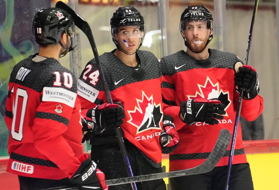 Dylan Cozens, centre, of Canada, celebrates his goal with teammates during the group A Hockey World Championship match against Kazakhstan in Helsinki, Finland, Thursday May 19 2022. Cozens scored three times, including two power-play goals that put the game out of reach, as Canada posted a 6-3 win over Kazakhstan in a penalty-filled game Thursday at the world hockey championship. THE CANADIAN PRESS/AP-Martin Meissner