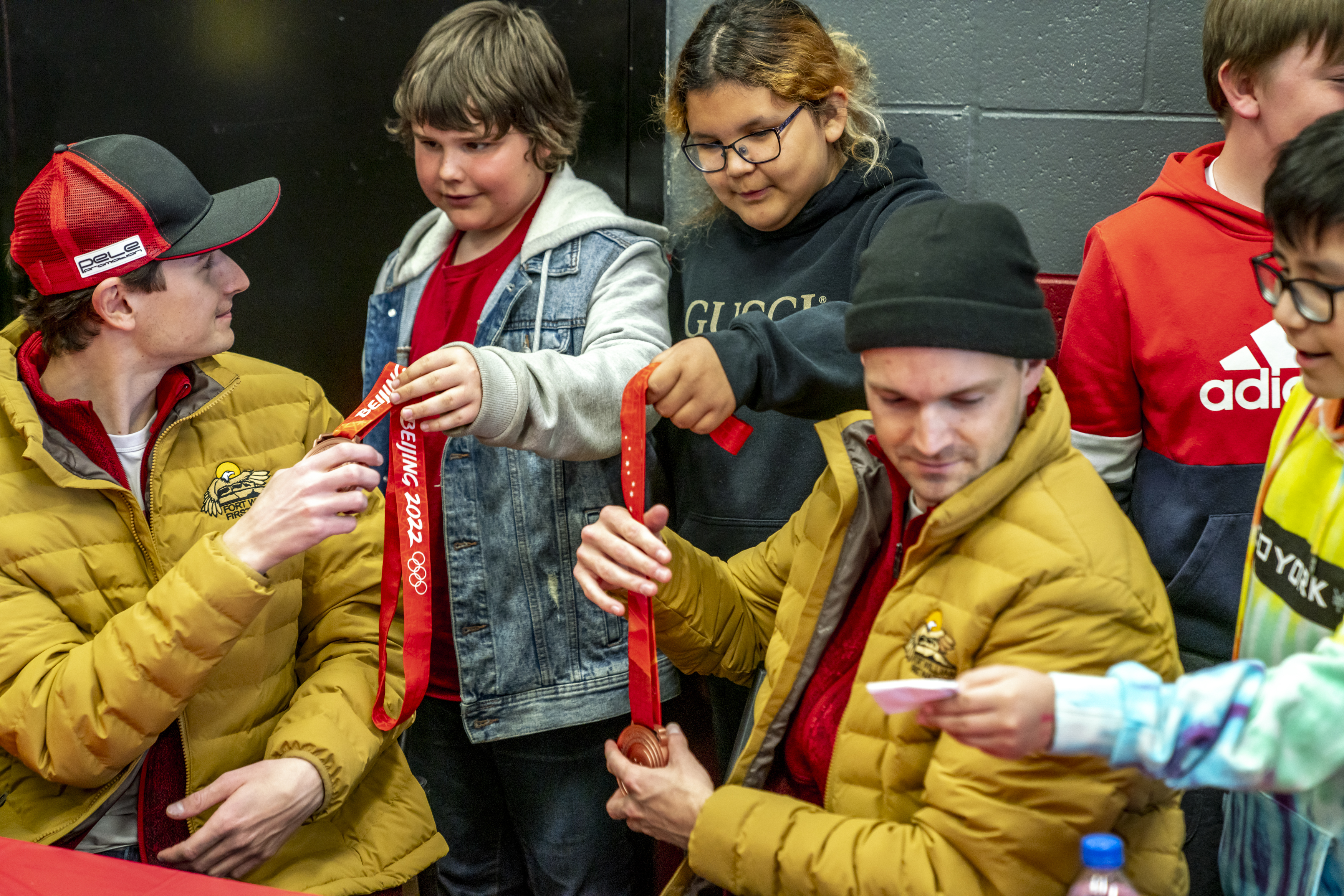 Mackenzie Boyd-Clowes and Matthew Soukup let Indigenous youth hold their Olympic bronze medals