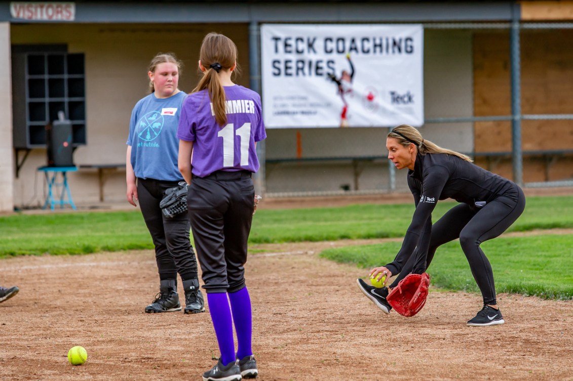 Lauren Regula shows young players how to field ground balls 