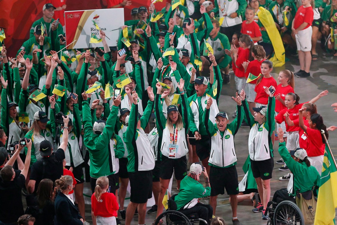 Team Saskatchewan cheers as they walk into the opening ceremony of the Canada Games