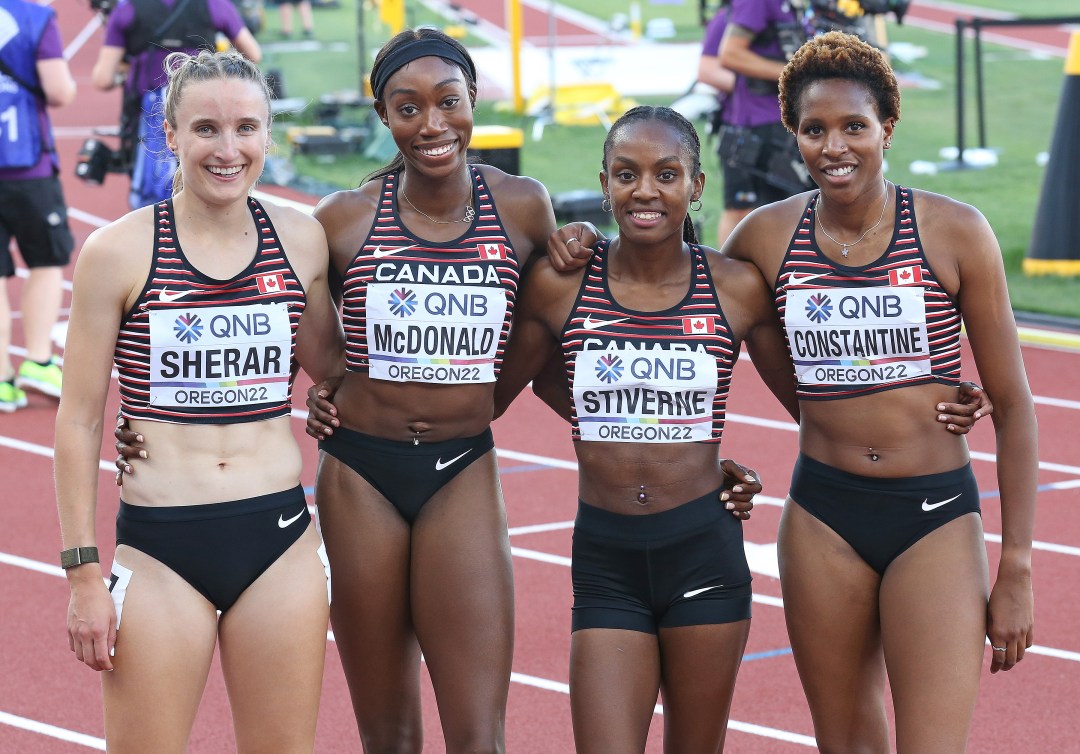 Four Canadian women pose for the camera after their race 