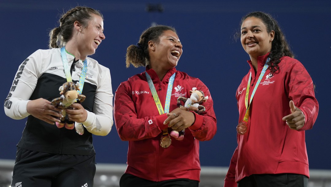 Camryn Rogers and Jillian Weir laugh on the podium