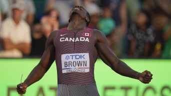 Aaron Brown, of Canada, celebrates after the final in the men's 4x100-meter relay at the World Athletics Championships on Saturday, July 23, 2022, in Eugene, Ore.