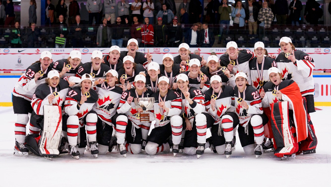 Team Canada celebrates winning gold at the 2022 IIHF Women's World Championship