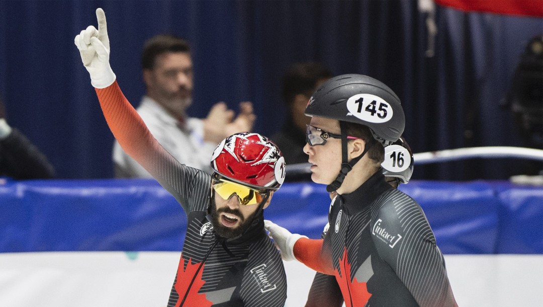 Steven Dubois of Canada, left, reacts after winning the 500-metre final race at the ISU World Cup Short Track Speed Skating event in Montreal, Sunday, October 30, 2022. THE CANADIAN PRESS/Graham Hughes