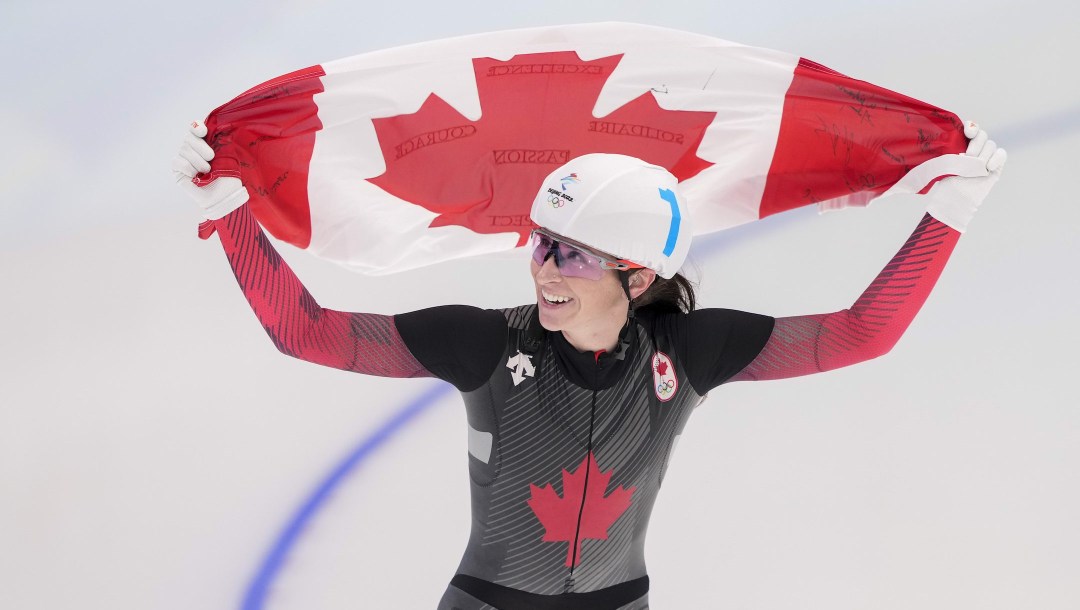 Canada's Ivanie Blondin celebrates her silver medal in the women's mass start speed skating final at the 2022 Winter Olympics in Beijing on Saturday, February 19, 2022. THE CANADIAN PRESS/Paul Chiasson