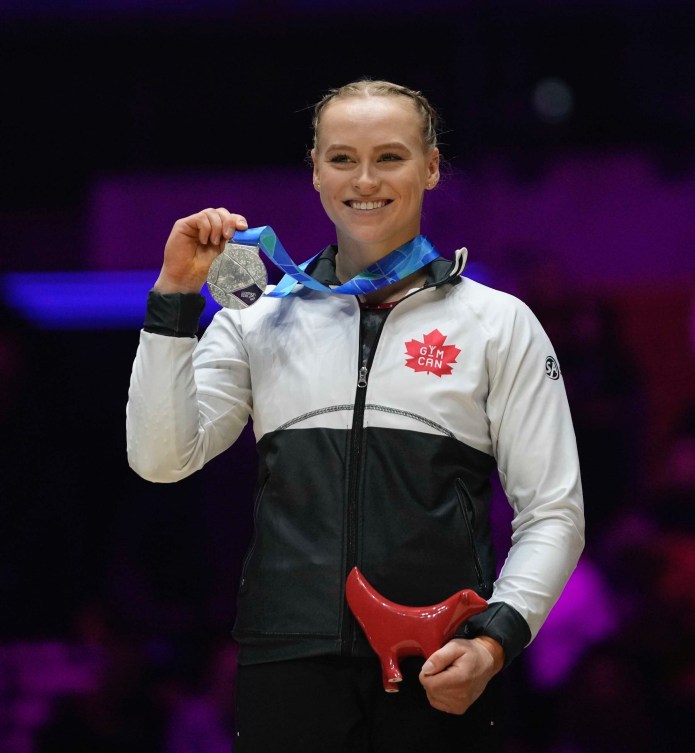 Silver medallist Canada's Elsabeth Black celebrates on the podium during the medal ceremony for the balance beam at the Artistic Gymnastics World Championships at M&S Bank Arena in Liverpool, England, Sunday, Nov. 6, 2022. (AP Photo/Thanassis Stavrakis)