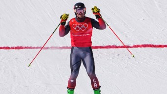 Canada's Reece Howden crosses the finish line in the freestyle men's ski cross 1/8 finals during the Beijing Winter Olympic Games, in Zhangjiakou, China, Friday, Feb. 18, 2022. THE CANADIAN PRESS/Sean Kilpatrick