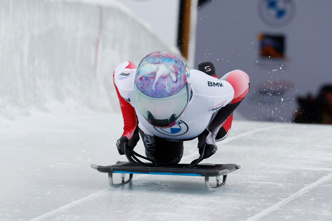 Mirela Rahneva lands chest first on her skeleton sled as it slides out of the start area on the track