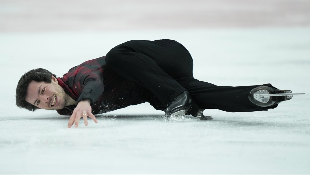 Keegan Messing performs a hydroblade move low to the ice