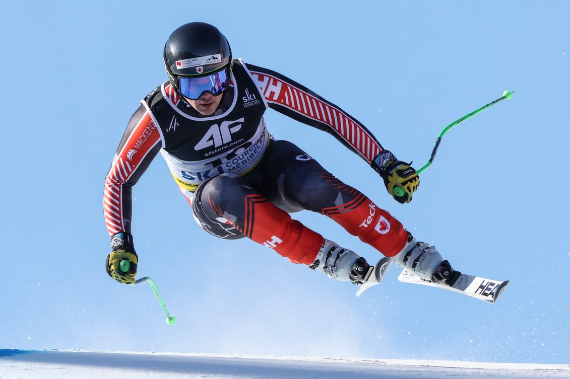 Jack Crawford gets some air as he skis in a super-G race