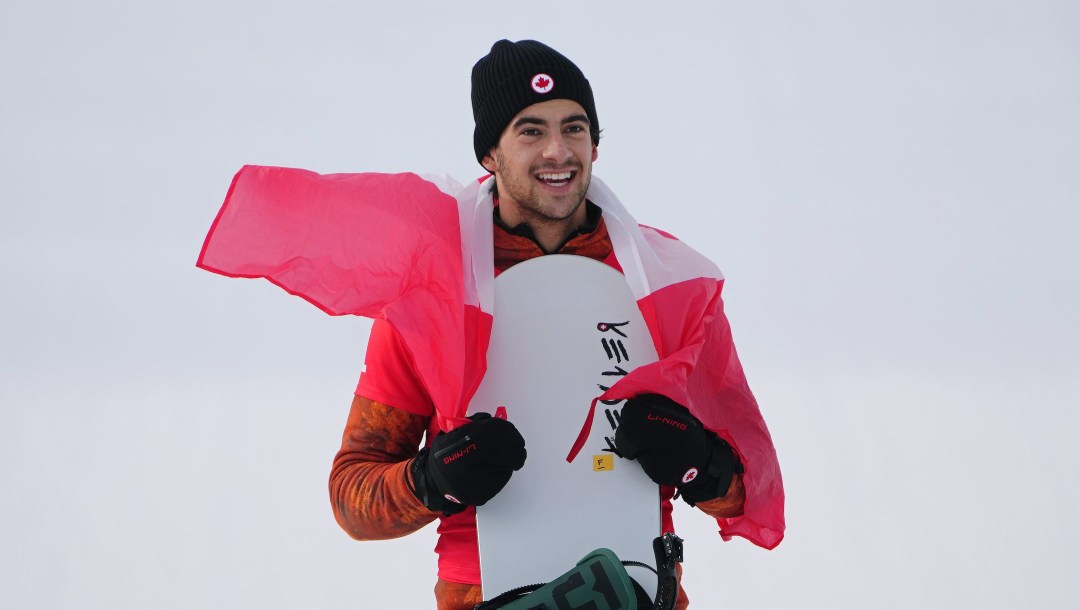 World Cup snowboard cross in Mont-Sainte-Anne, Que., has been postponed because of warm temperatures and lack of snow. Canada's Eliot Grondin celebrates his silver medal in men's snowboard cross at the 2022 Beijing Winter Olympics in Zhangjiakou, China on Thursday, February 10, 2022. THE CANADIAN PRESS/Sean Kilpatrick