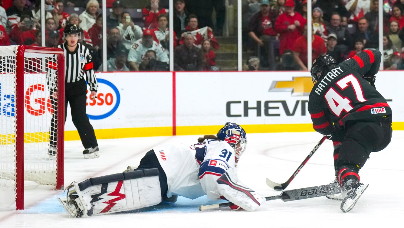 Jamie Lee Rattray scores against USA goaltender Aerin Frankel at 2023 IIHF Women's World Championship