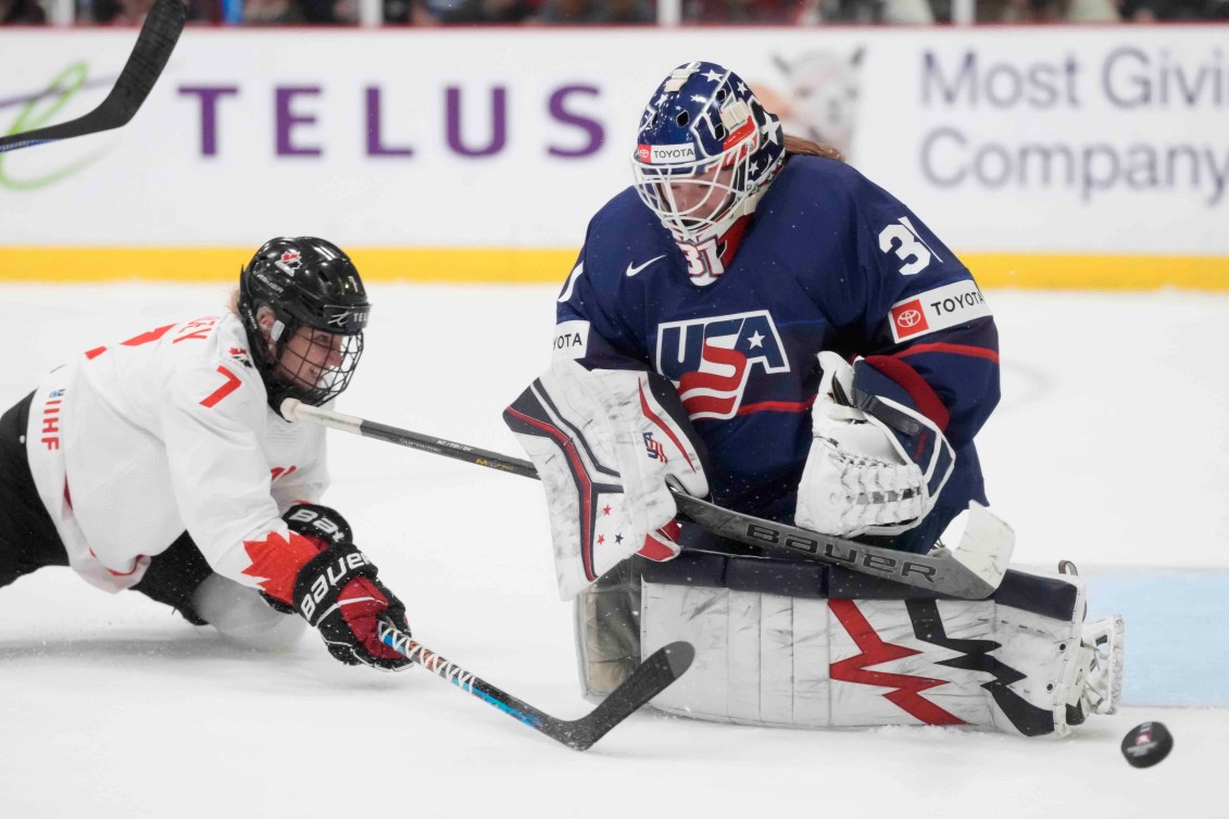 Team Canada's Ella Shelton has her shot stopped against the United States in the gold medal game of the 2023 IIHF Women's World Championship.
