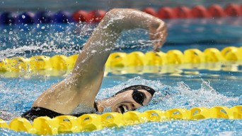 Emma O'Croinin swims freestyle stroke in a race