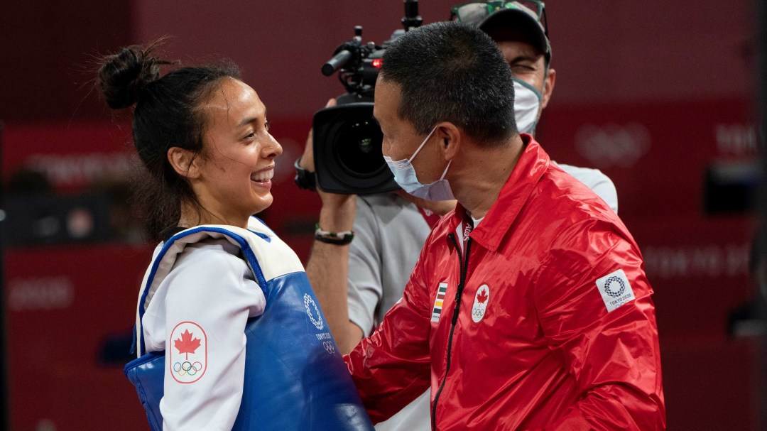 Skylar Park laughs as she talks to her dad and coach Jae