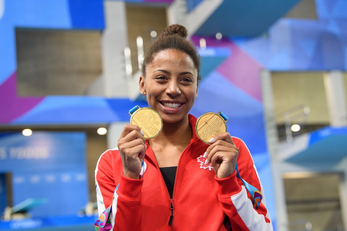 Jennifer Abel poses with her medals at the Lima 2019 Pan American Games