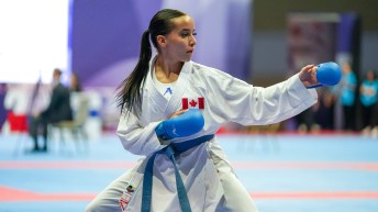Yamina Lahyanssa prepares to punch an opponent in a karate match