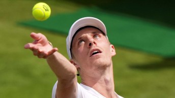 Canada's Denis Shapovalov serves to Gregoire Barrere of France in a men's singles match on day four of the Wimbledon tennis championships in London, Thursday, July 6, 2023.