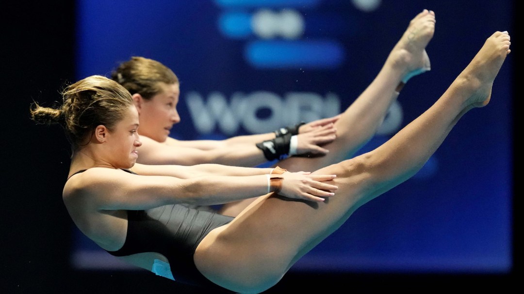 Side angle of Caeli McKay and Kate Miller diving