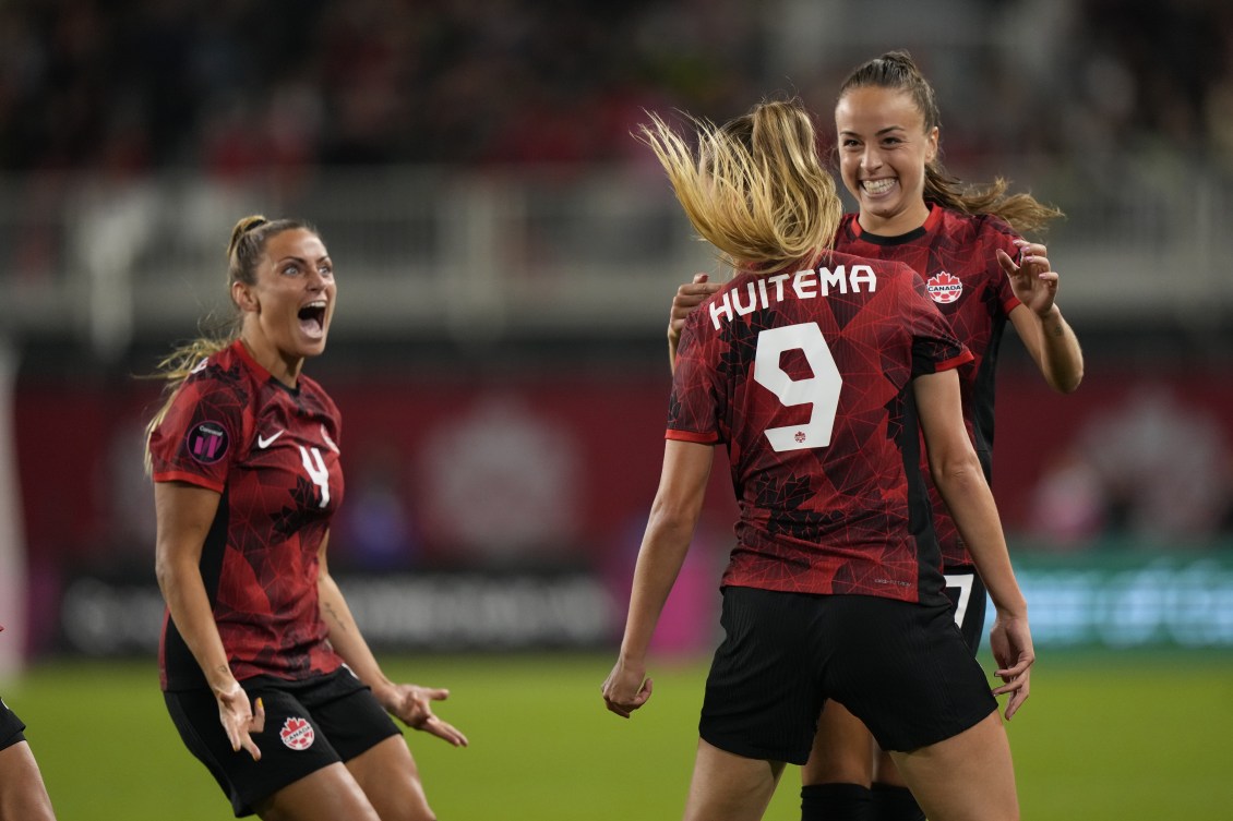 Canada players celebrate a goal