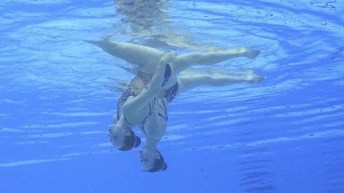A photo of Scarlett Fin take from underwater as she is inverted