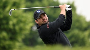 Etienne Papineau takes a swing on the golf course