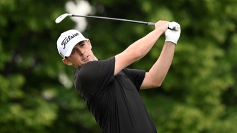 Myles Creighton swings on the golf course