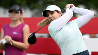 Selena Costabile swings on the golf course