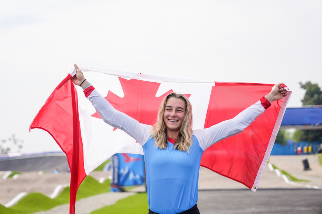 Molly Simpson holds up a Canadian flag