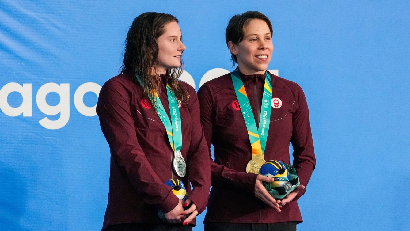 Sophie Angus and Rachel Nicol wear their silver and gold medals on the podium 