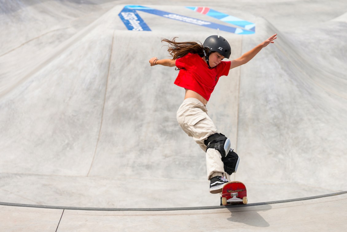 Fay De Fazio Ebert rides her skateboard up a ramp