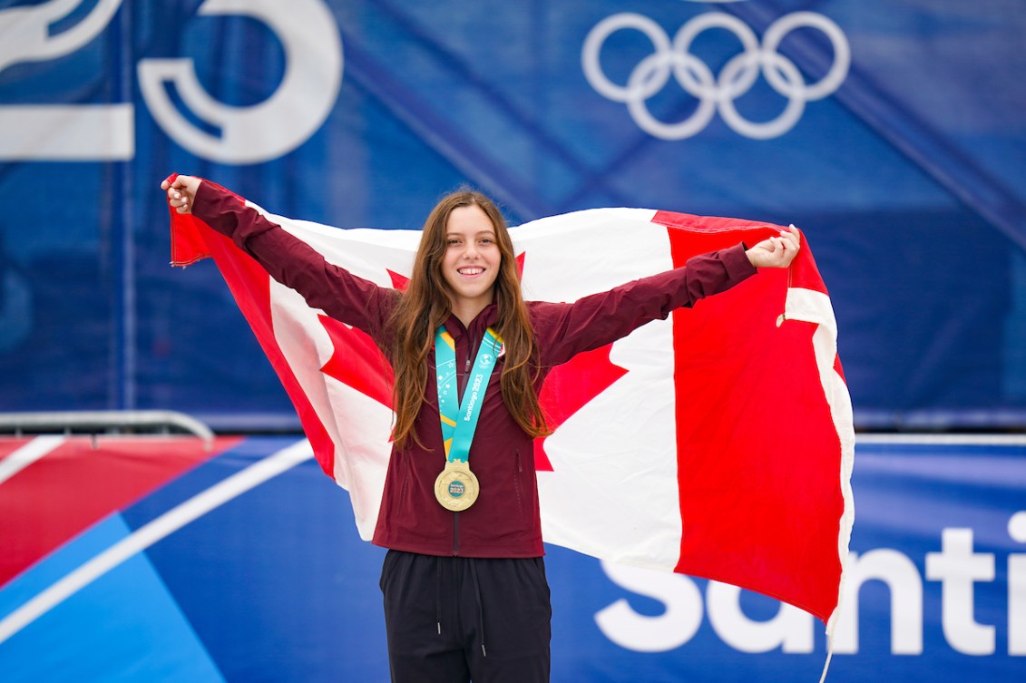 Fay De Fazio Ebert poses with her gold medal and the Canadian flag