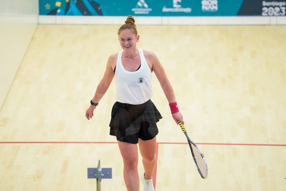 Hollie Naughton smiles on the squash court